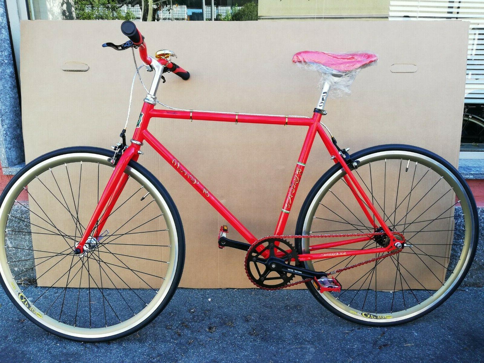 bicicletta uomo rossa con cerchi mavic da